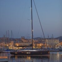 Beneteau First Yacht 53 docked in harbor at night