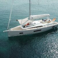 Beneteau Oceanis 46.1 with sails down in turquoise water