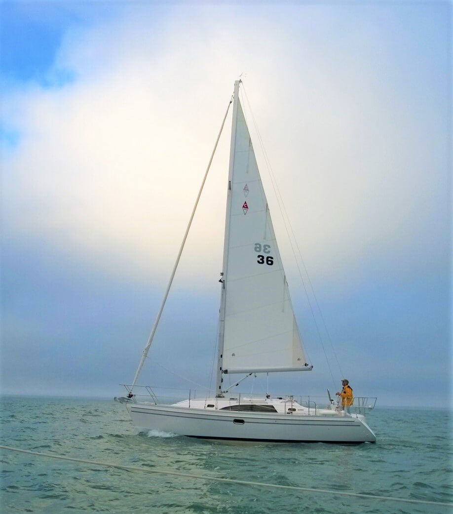 Catalina Yachts 315 with white sail on open waters