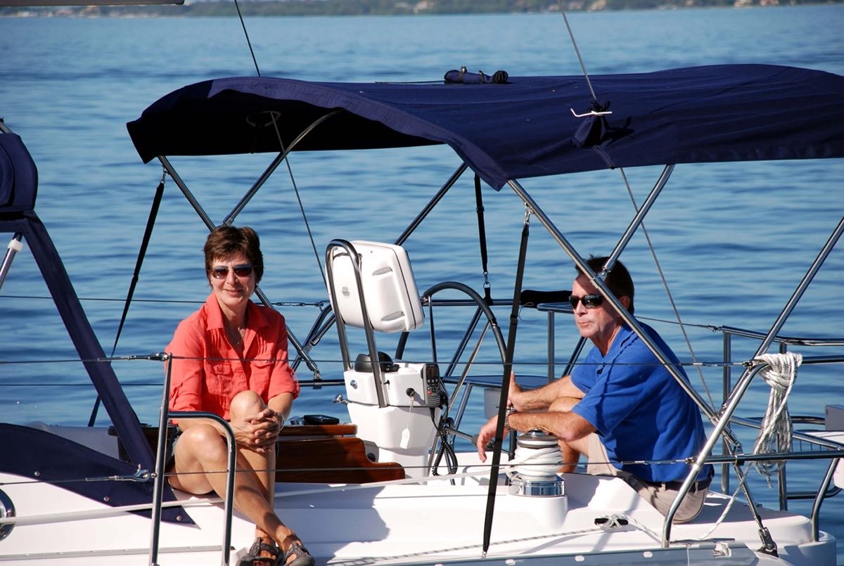 couple sitting under helm canopy on a Catalina Yachts 385
