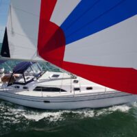 Catalina Yachts 385 turning in open waters with full sail