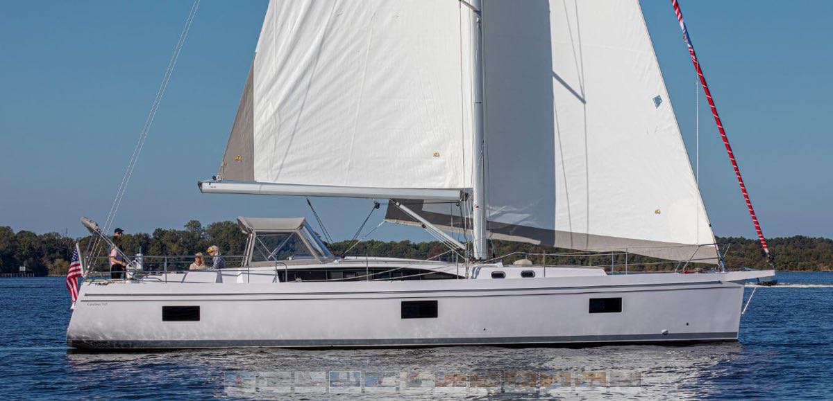 Catalina Yachts 545 sideview with white sails in water