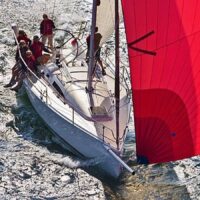 J Boats J/111 with red sail in open water