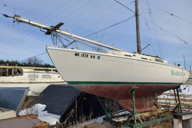 Hughes 26 - "Shamrock" sailboat on saddle in outdoor storage yard