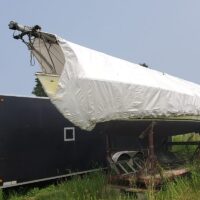 Shark 24 - "Time Off" wrapped in white on saddle in storage yard