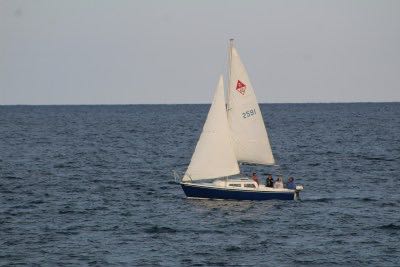 white sailboat on open water