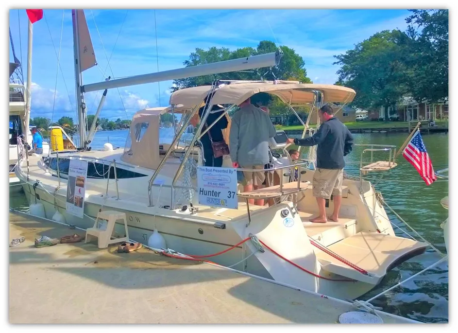 2015 Marlow-Hunter 37 sailboat with people touring onboard in marina