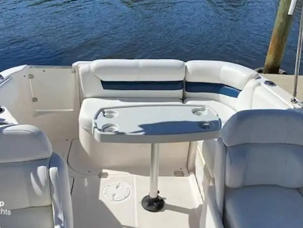 seating area with table on the 2005 Regal 2120 Destiny powerboat