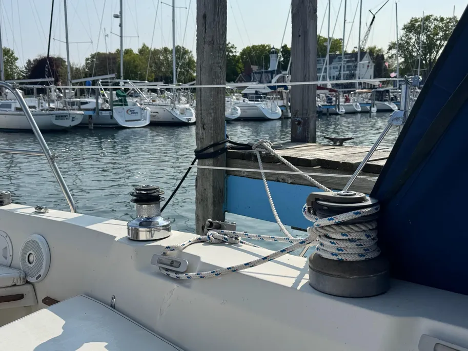 1980 C&C 32 sail boat tied to dock