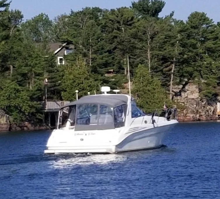 1997 Sea Ray 400 Sundancer cruising in water