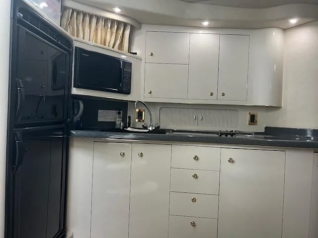 1997 Sea Ray 400 Sundancer interior galley cabinets