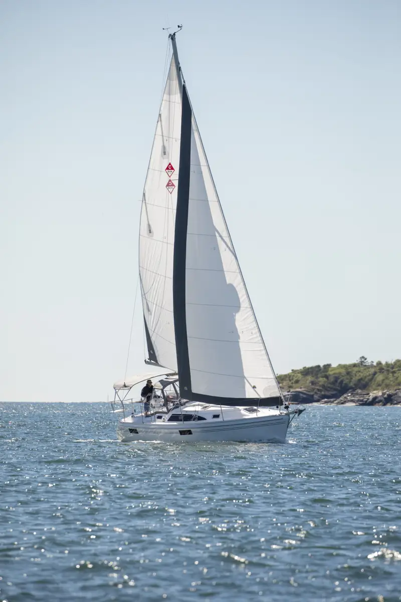 Catalina 316 sailboat with full sail on water