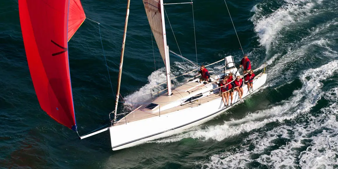 Crew of seven sailing a J-Boat J/111 sailboat.