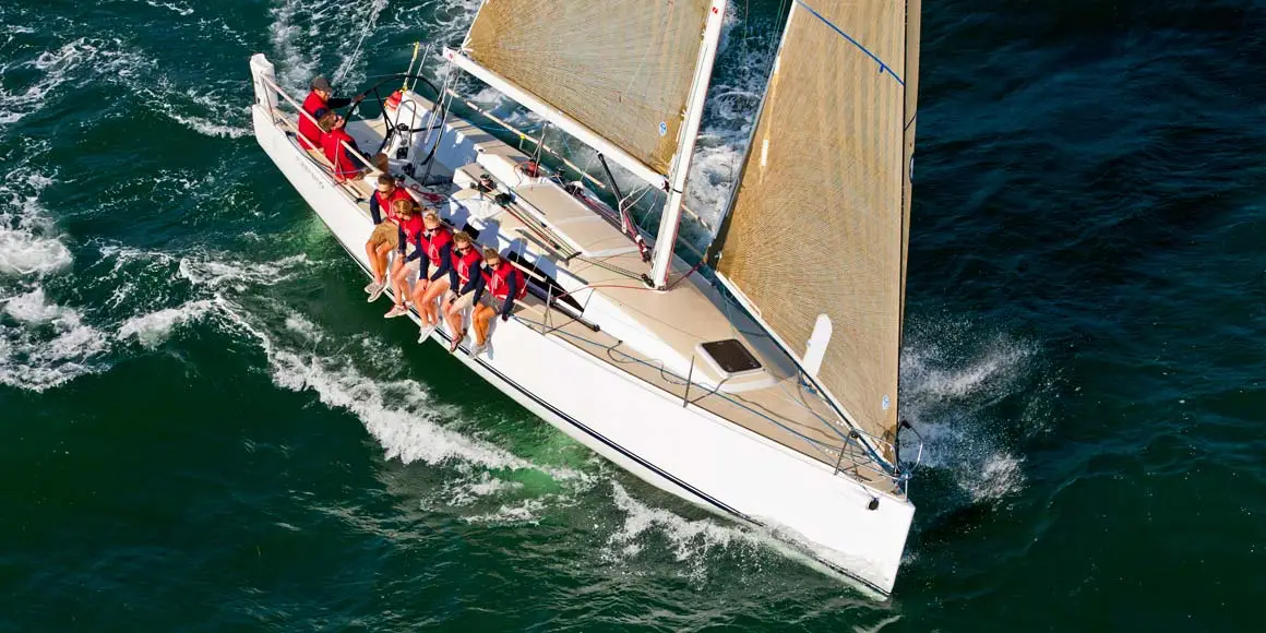 Crew of seven sailing a J-Boat J/111 sailboat.