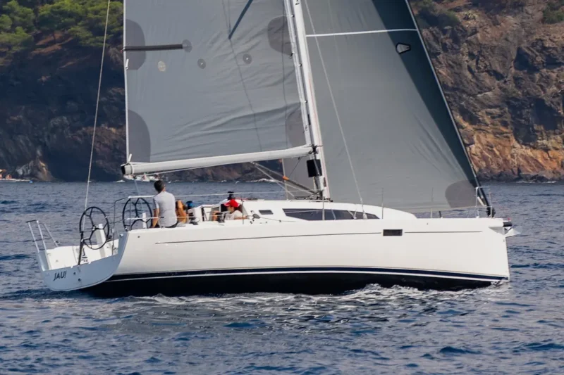Group of people sailing in a J-Boat J-36 sailboat.