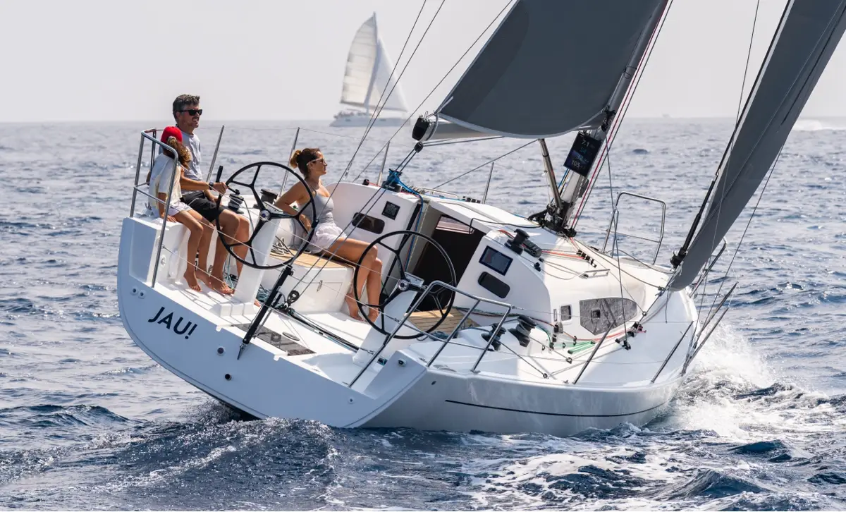 Group of people sailing in a J-Boat J-36 sailboat.