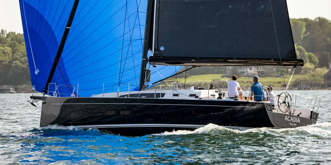 Three men sailing a J-Boat J/45 sailboat.