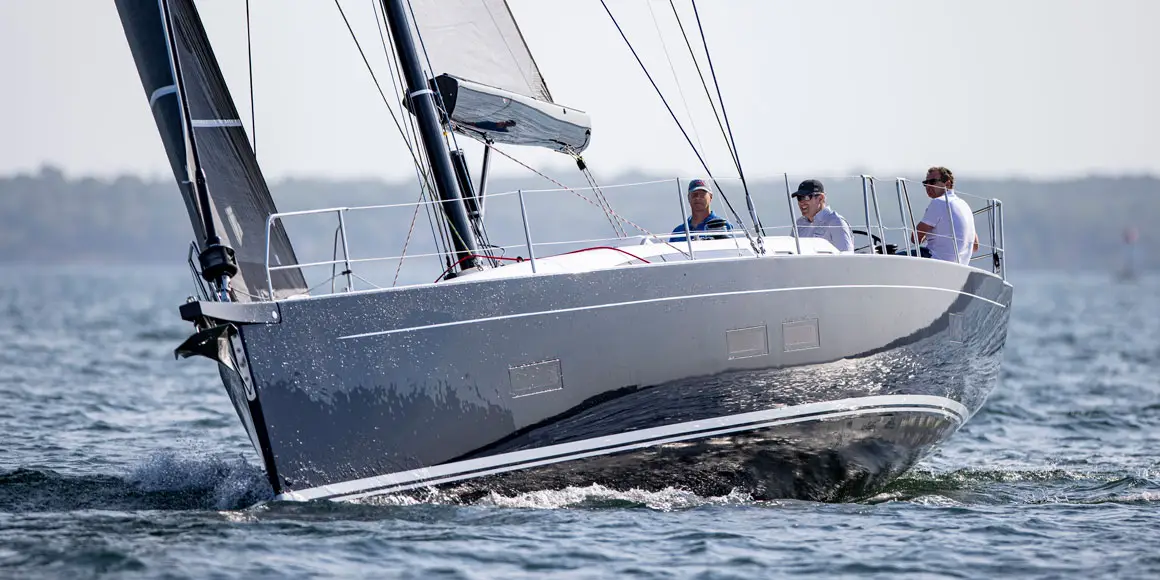 Three men sailing a J-Boat J/45 sailboat.