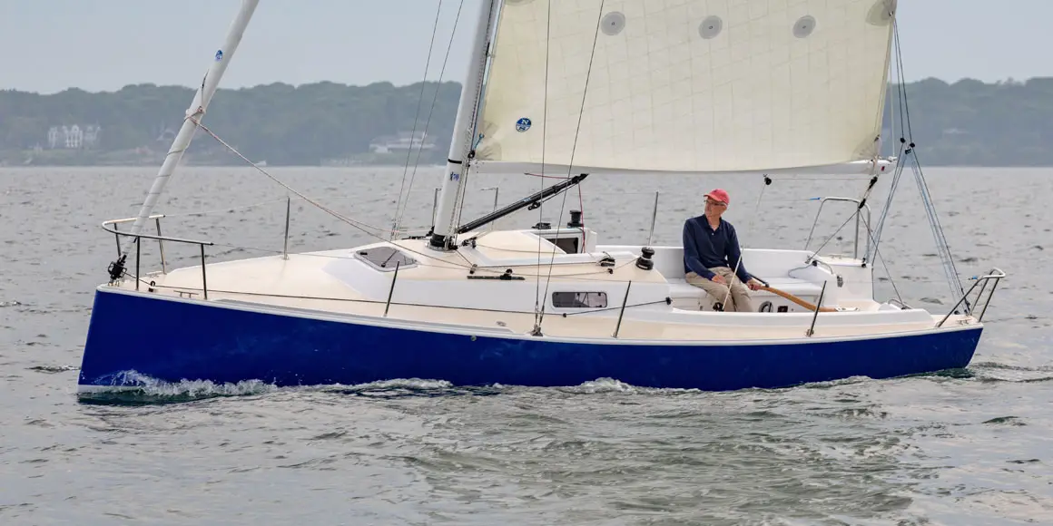Older solo sailor on a J-Boat J/9 sailboat.