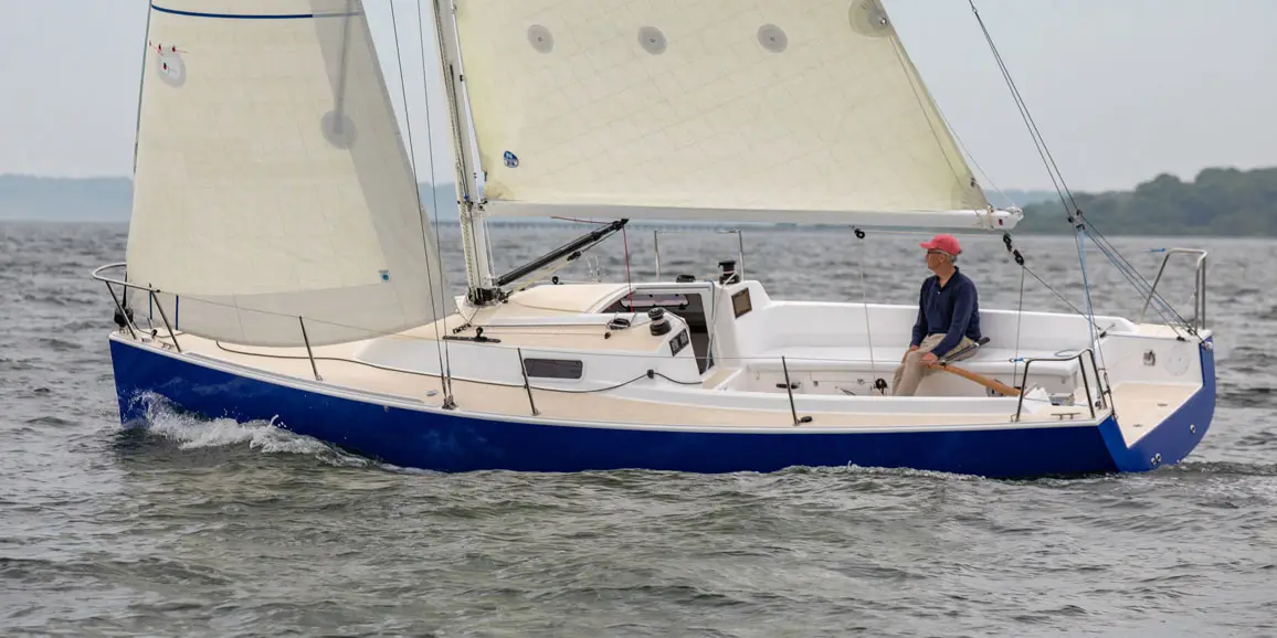 Older solo sailor on a J-Boat J/9 sailboat.