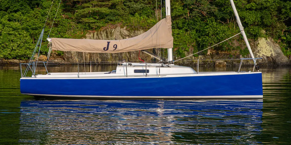 J-Boat J/9 sailboat with sail down.