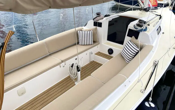Deck view with beige seating on a J-Boat J/9 sailboat.