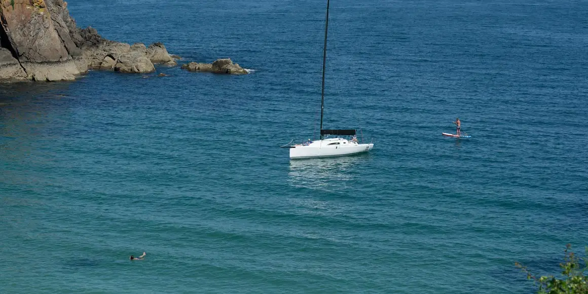 J-Boat J99 sailboat without sail in water.