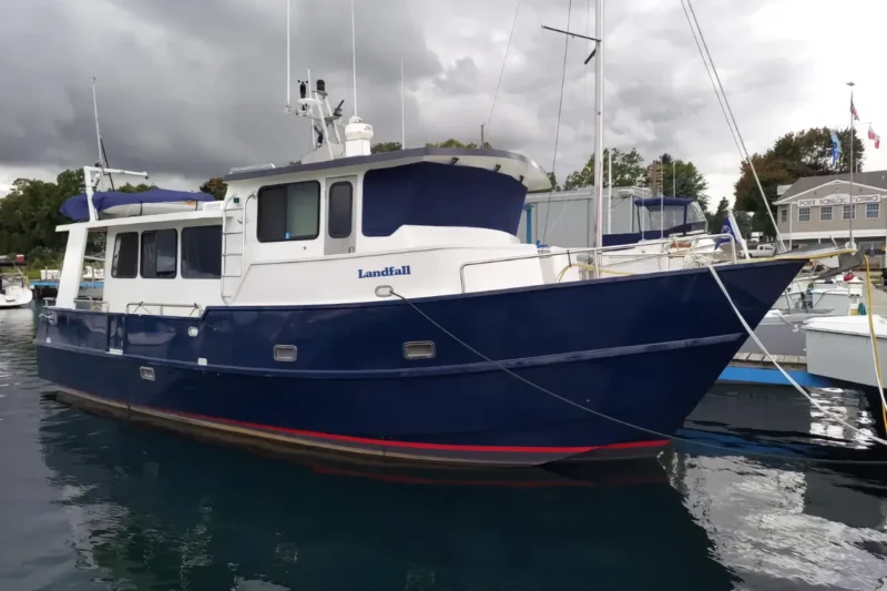 2003 Dovercraft 43 powerboat docked in a marina.
