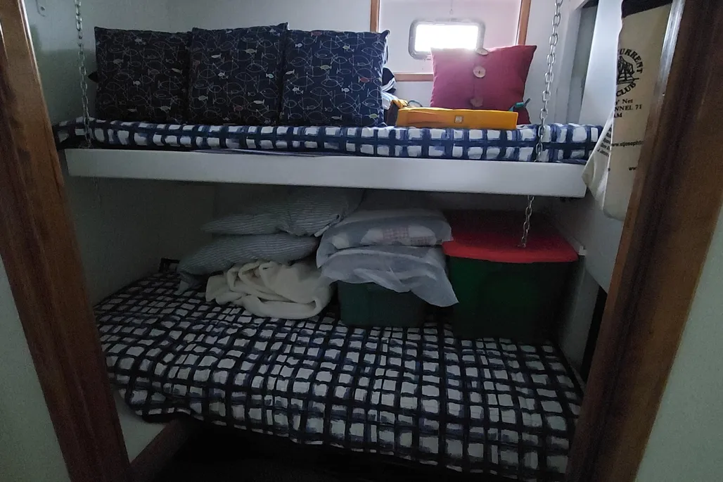 Stateroom with a bunk bed on a 2003 Dovercraft 43 powerboat.