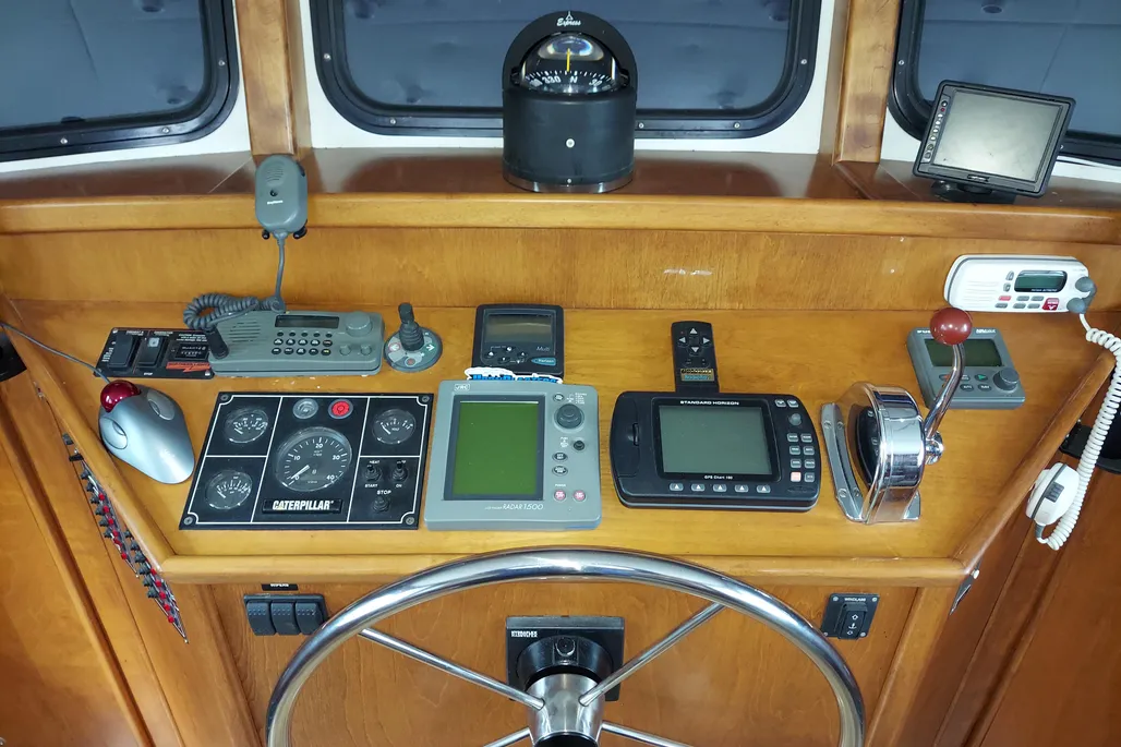 Helm and various control panels on a 2003 Dovercraft 43 powerboat.