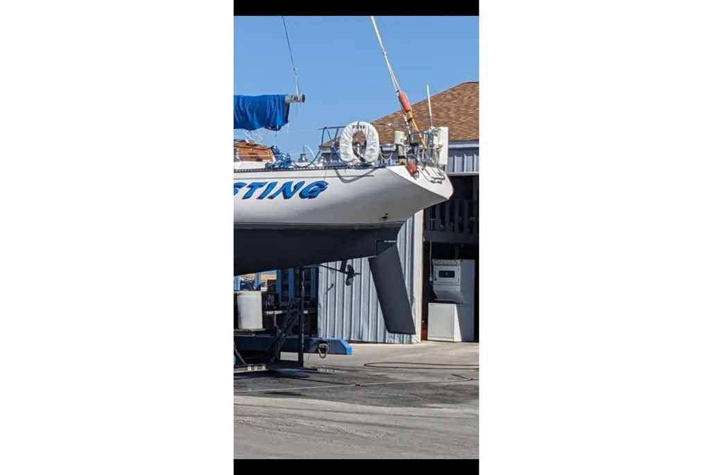 1984 Catalina 38 sailboat on a lift with rudder showing.